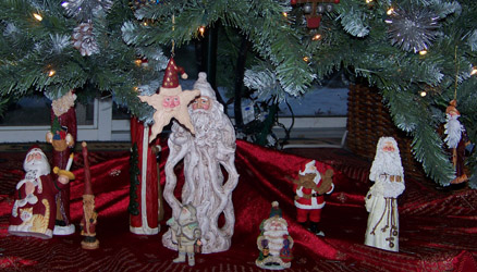Collection of Santas under the tree