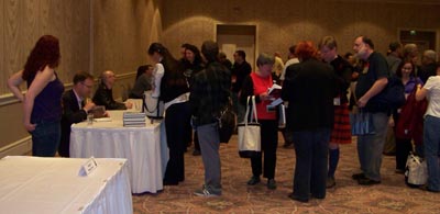 One more photo of people getting books signed at World Fantasy 2009