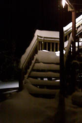 Snow from the bottom of the deck stairway looking up